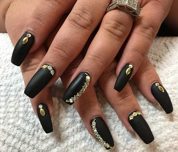 women's black and gold nails