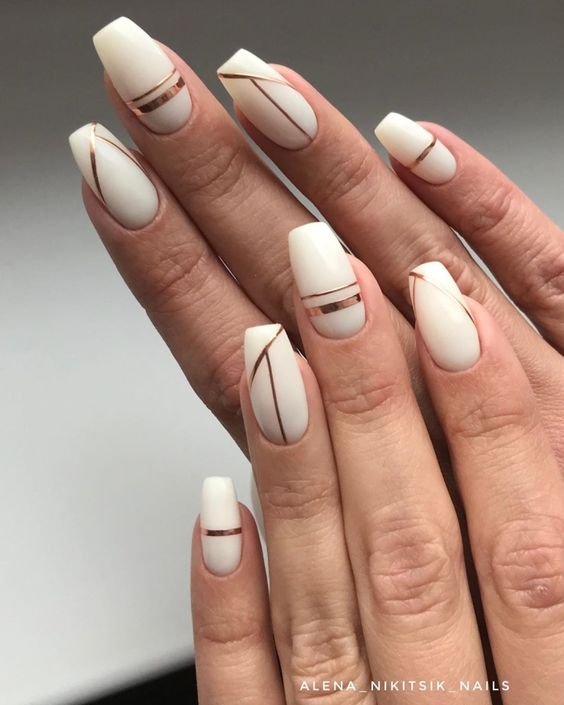 women's white and gold nails